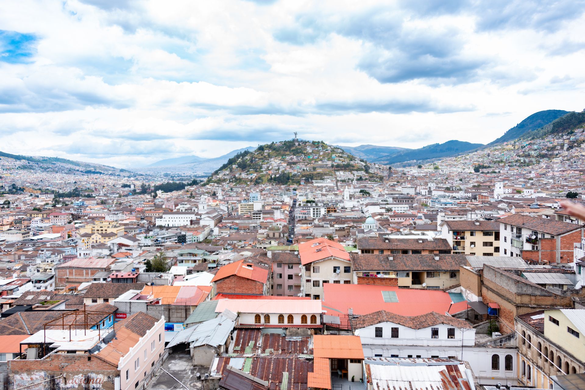 Urban landscape of Quito with rolling hills
